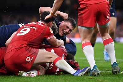 210226 - Wales v Scotland - Guinness Men's Six Nations - Scotland players celebrate after George Turner of Scotland pushes the ball over to score a try