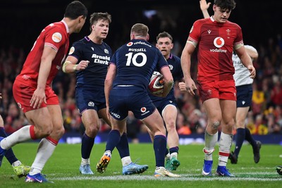 210226 - Wales v Scotland - Guinness Men's Six Nations - Finn Russell of Scotland celebrates scoring a try with team mates