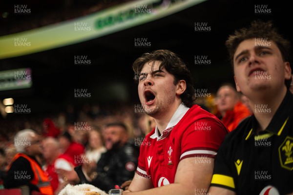 210226 - Wales v Scotland - Guinness Six Nations - Fans react inside the Stadium during the match 