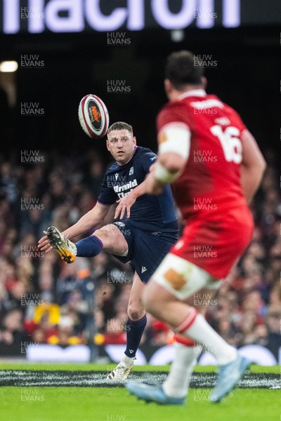 210226 - Wales v Scotland - Guinness Six Nations - Finn Russell of Scotland kicks the ball forwards 