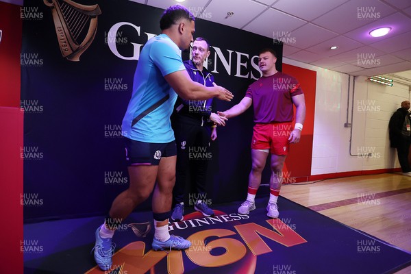 210226 - Wales v Scotland - Guinness Six Nations Championship - Captains Sione Tuipulotu of Scotland and Dewi Lake of Wales during the coin toss