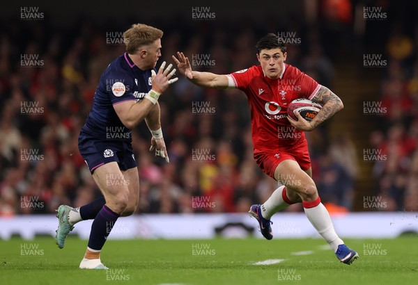 210226 - Wales v Scotland - Guinness Six Nations Championship - Louis Rees-Zammit of Wales is tackled by Kyle Steyn of Scotland 