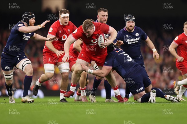 210226 - Wales v Scotland - Guinness Six Nations Championship - Rhys Carre of Wales is tackled by Zander Fagerson of Scotland 