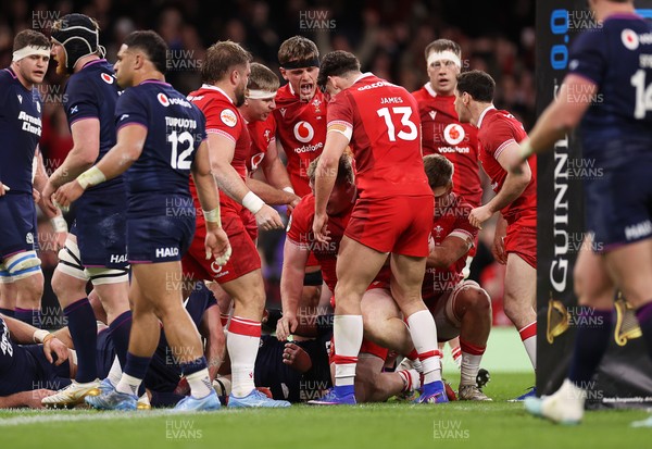 210226 - Wales v Scotland - Guinness Six Nations Championship - Rhys Carre of Wales celebrates scoring a try with team mates