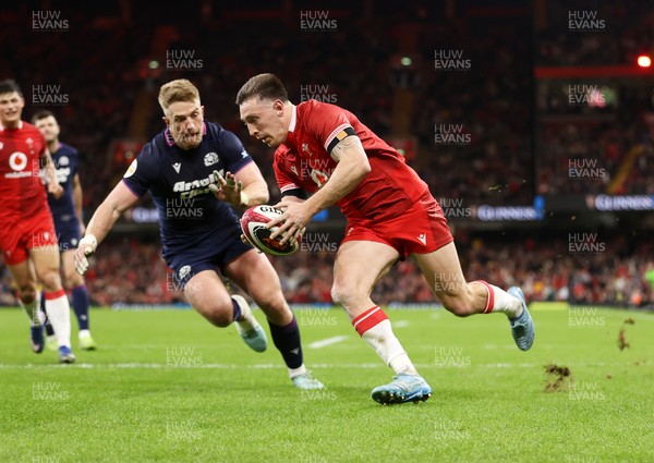 210226 - Wales v Scotland - Guinness Six Nations Championship - Josh Adams of Wales runs in to score a try