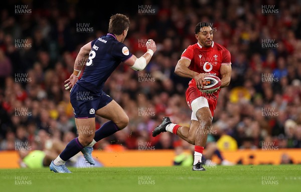 210226 - Wales v Scotland - Guinness Six Nations Championship - Gabriel Hamer-Webb of Wales is tackled by Huw Jones of Scotland 