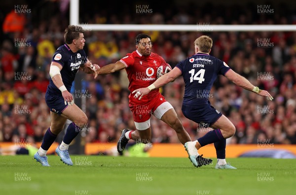 210226 - Wales v Scotland - Guinness Six Nations Championship - Gabriel Hamer-Webb of Wales is tackled by Huw Jones of Scotland 
