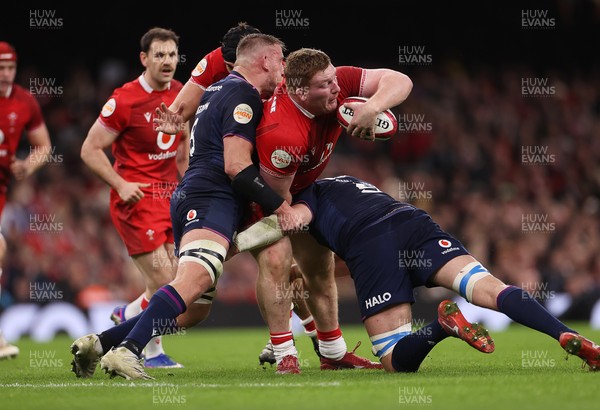 210226 - Wales v Scotland - Guinness Six Nations Championship - Rhys Carre of Wales is tackled by Matt Fagerson of Scotland 