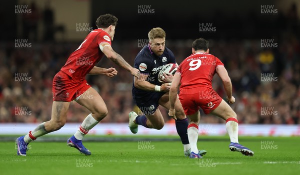 210226 - Wales v Scotland, 2026 Guinness Six Nations - Kyle Steyn of Scotland takes on Eddie James of Wales and Tomos Williams of Wales