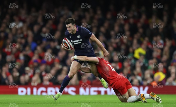 210226 - Wales v Scotland, 2026 Guinness Six Nations - Blair Kinghorn of Scotland is tackled by Joe Hawkins of Wales