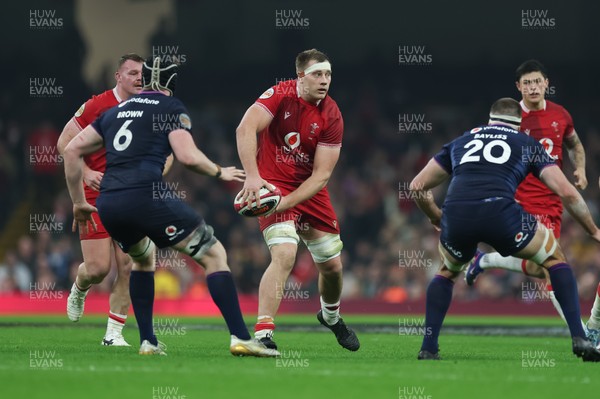 210226 - Wales v Scotland, 2026 Guinness Six Nations - Ben Carter of Wales takes on Gregor Brown of Scotland and Josh Bayliss of Scotland