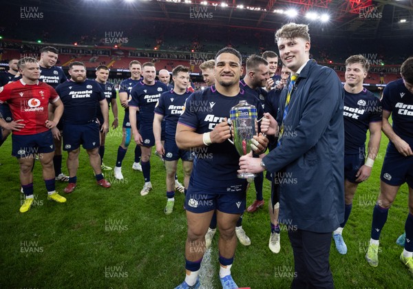 210226 - Wales v Scotland, 2026 Guinness Six Nations - Hamish Weir presents Sione Tuipulotu of Scotland with the Doddie Weir Cup at the end of the match