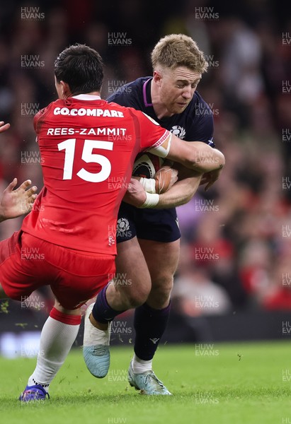 210226 - Wales v Scotland, 2026 Guinness Six Nations - Kyle Steyn of Scotland takes on Louis Rees-Zammit of Wales