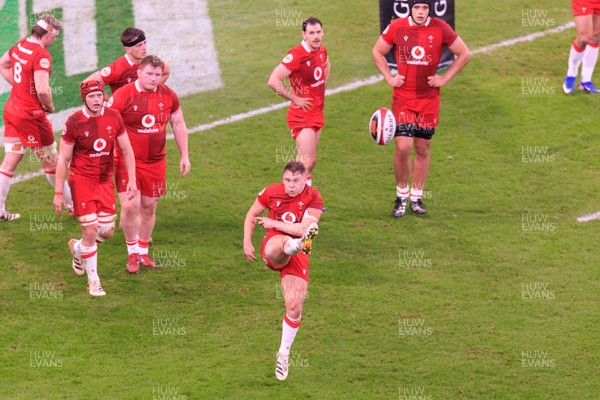 210226 - Wales v Scotland - Guinness Six Nations - Sam Costelow of Wales kicks for touch