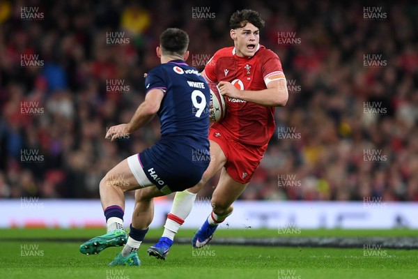 210226 - Wales v Scotland - Guinness Men's Six Nations - Eddie James of Wales is challenged by Ben White of Scotland