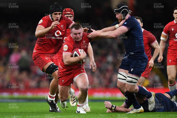 210226 - Wales v Scotland - Guinness Men's Six Nations - Dewi Lake of Wales is challenged by Rory Darge of Scotland