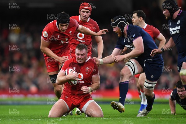 210226 - Wales v Scotland - Guinness Men's Six Nations - Dewi Lake of Wales is challenged by Rory Darge of Scotland
