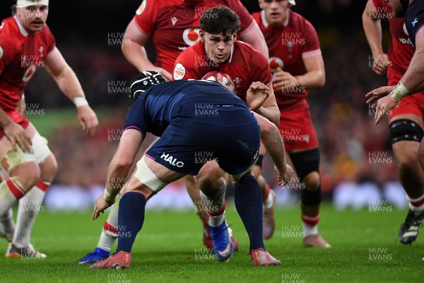 210226 - Wales v Scotland - Guinness Men's Six Nations - Eddie James of Wales is challenged by Max Williamson of Scotland