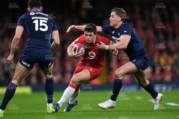 210226 - Wales v Scotland - Guinness Men's Six Nations - Louis Rees-Zammit of Wales is challenged by Duhan van der Merwe of Scotland