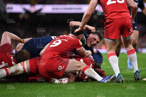 210226 - Wales v Scotland - Guinness Men's Six Nations - Scotland players celebrate after George Turner of Scotland pushes the ball over to score a try