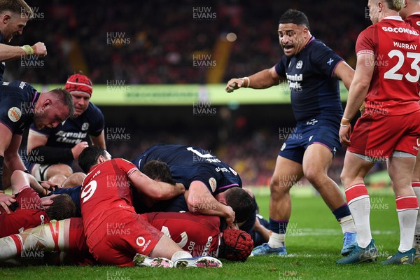 210226 - Wales v Scotland - Guinness Men's Six Nations - Scotland players celebrate after George Turner of Scotland pushes the ball over to score a try