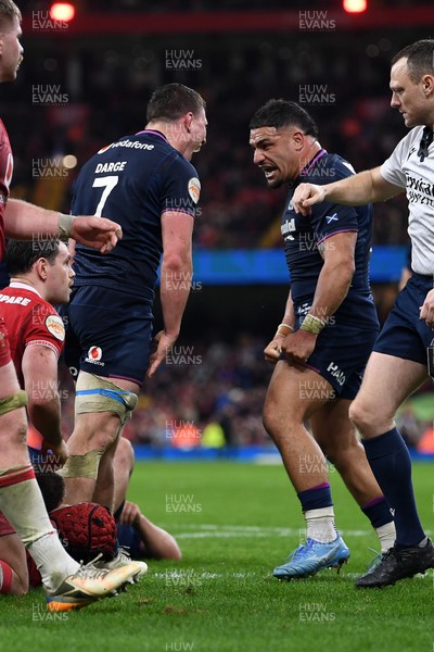 210226 - Wales v Scotland - Guinness Men's Six Nations - Sione Tuipulotu and Rory Darge of Scotland celebrates after George Turner of Scotland pushes the ball over to score a try