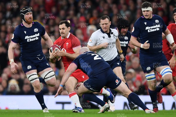 210226 - Wales v Scotland - Guinness Men's Six Nations - Tomos Williams of Wales is challenged by Dave Cherry of Scotland