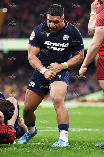 210226 - Wales v Scotland - Guinness Men's Six Nations - Sione Tuipulotu of Scotland celebrates scoring a try after George Turner of Scotland pushes the ball over to score a try