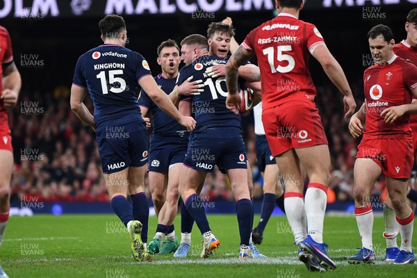 210226 - Wales v Scotland - Guinness Men's Six Nations - Finn Russell of Scotland celebrates scoring a try with team mates