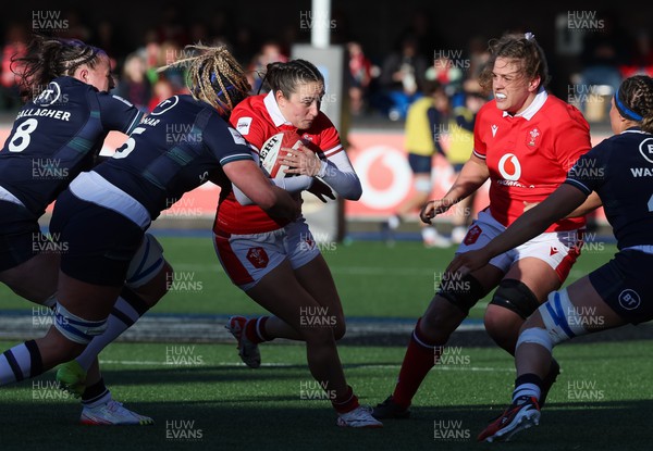 230324 - Wales v Scotland, Guinness Women’s 6 Nations - Nel Metcalfe of Wales is held