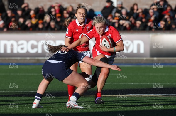 230324 - Wales v Scotland, Guinness Women’s 6 Nations - Alex Callender of Wales takes on Helen Nelson of Scotland