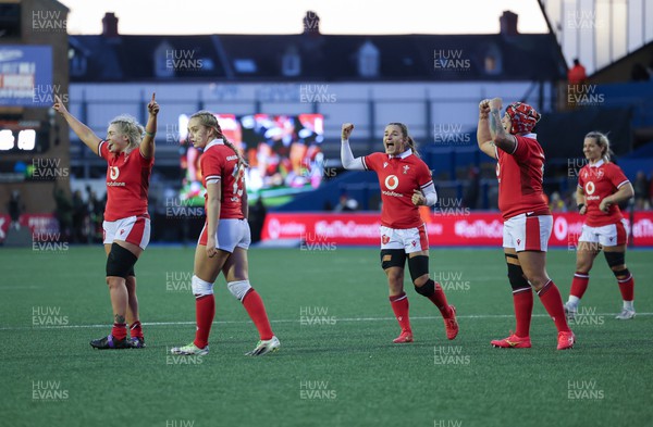 230324 - Wales v Scotland, Guinness Women’s 6 Nations - Alex Callender of Wales, Hannah Jones of Wales, Jasmine Joyce of Wales and Donna Rose of Wales celebrate as a late try is awards