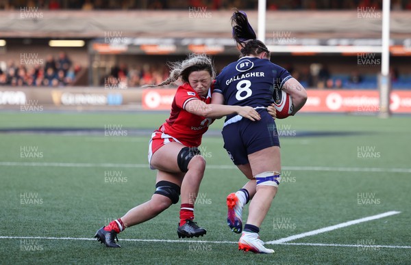 230324 - Wales v Scotland, Guinness Women’s 6 Nations - Alisha Butchers of Wales tackles Evie Gallagher of Scotland