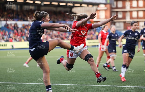 230324 - Wales v Scotland, Guinness Women’s 6 Nations - Alisha Butchers of Wales looks to charge down the kick from Helen Nelson of Scotland