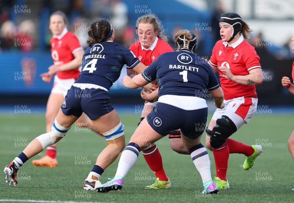 230324 - Wales v Scotland, Guinness Women’s 6 Nations - Abbie Fleming of Wales takes on Emma Wassell of Scotland and Leah Bartlett of Scotland