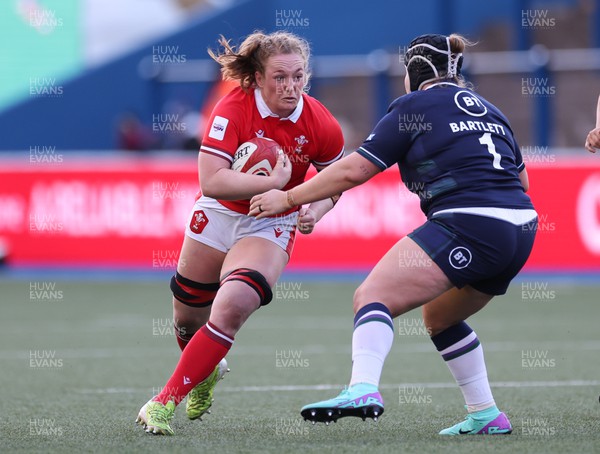 230324 - Wales v Scotland, Guinness Women’s 6 Nations - Abbie Fleming of Wales takes on Leah Bartlett of Scotland