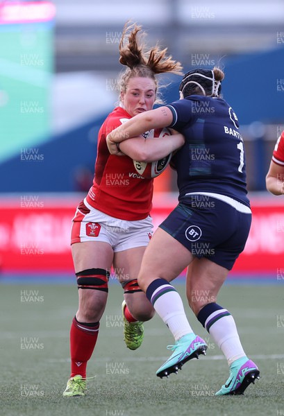 230324 - Wales v Scotland, Guinness Women’s 6 Nations - Abbie Fleming of Wales takes on Leah Bartlett of Scotland