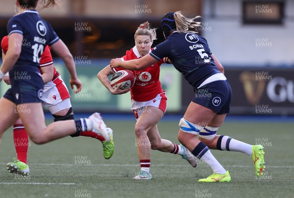 230324 - Wales v Scotland, Guinness Women’s 6 Nations - Keira Bevan of Wales takes on Sarah Bonar of Scotland