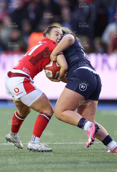 230324 - Wales v Scotland, Guinness Women’s 6 Nations - Sian Jones of Wales is held during the match