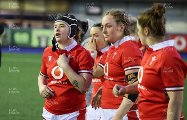 230324 - Wales v Scotland, Guinness Women’s 6 Nations - Bethan Lewis of Wales, Abbie Fleming of Wales and Kate Williams of Wales, at the end of the match