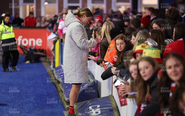 230324 - Wales v Scotland, Guinness Women’s 6 Nations - Alisha Butchers of Wales signs autographs at the end of the match