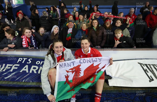 230324 - Wales v Scotland, Guinness Women’s 6 Nations - Nel Metcalfe of Wales and Gwenllian Pyrs of Wales with supporters at the end of the match