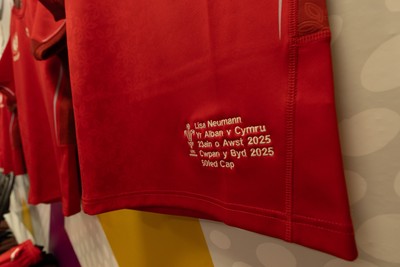 230825 - Wales v Scotland, Women’s Rugby World Cup - Lisa Neumann of Wales’ 50th cap shirt hangs in the Wales team changing room set for their opening Women’s Rugby World Cup match against Scotland