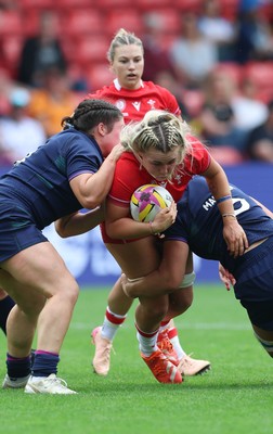 230825 - Wales v Scotland, Women’s Rugby World Cup - Alex Callender of Wales is tackled