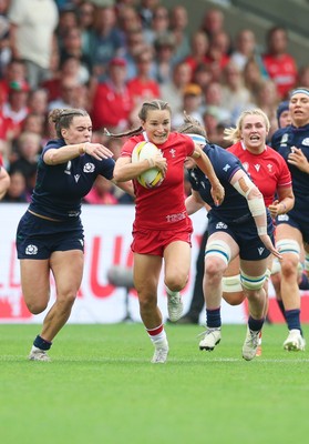230825 - Wales v Scotland, Women’s Rugby World Cup - Jasmine Joyce-Butchers of Wales breaks away