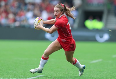 230825 - Wales v Scotland, Women’s Rugby World Cup - Lisa Neumann of Wales breaks away