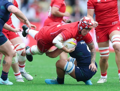 230825 - Wales v Scotland, Women’s Rugby World Cup - Donna Rose of Wales is tackled as she charges forward