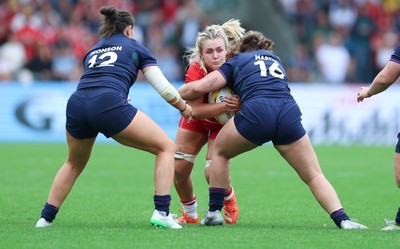 230825 - Wales v Scotland, Women’s Rugby World Cup - Alex Callender of Wales takes on Elis Martin of Scotland
