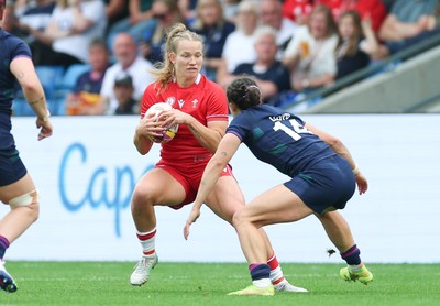 230825 - Wales v Scotland, Women’s Rugby World Cup - Carys Cox of Wales takes on Rhona Lloyd of Scotland