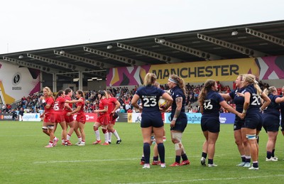 230825 - Wales v Scotland, Women’s Rugby World Cup - Wales players react as Scotland celebrate at the end of the match